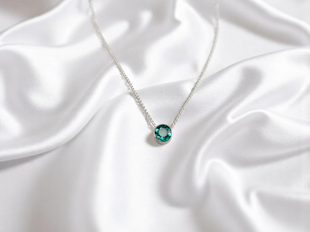 Delicate emerald birthstone pendant on 16-inch silver chain - May's stone of renewal