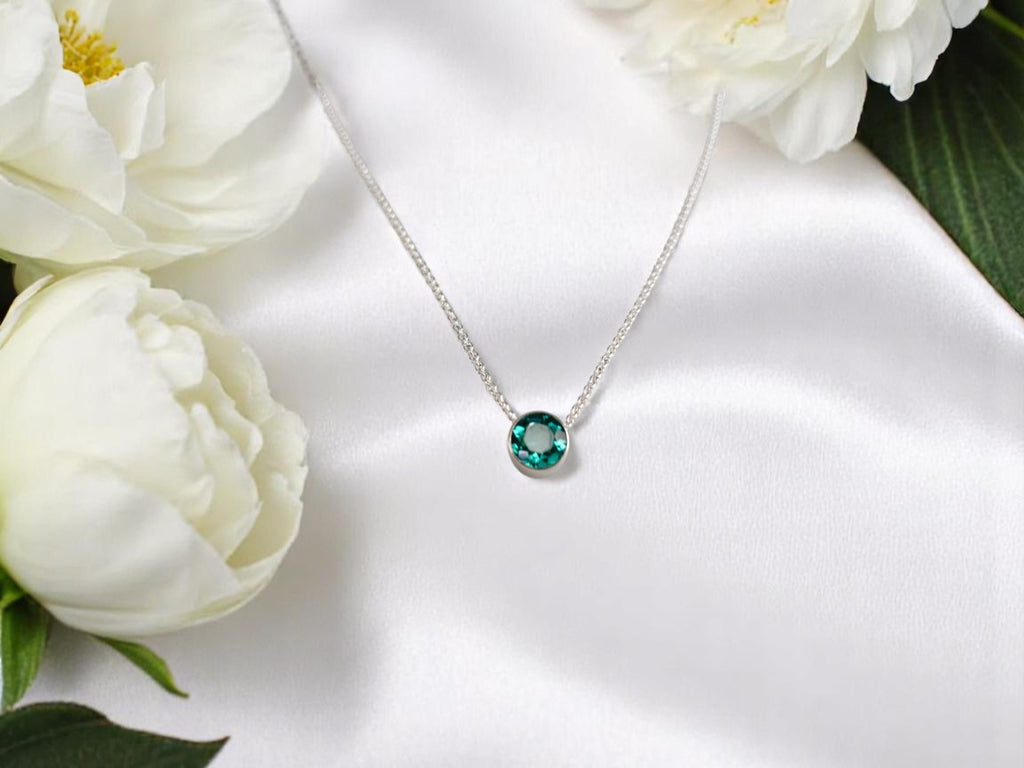 Delicate emerald birthstone pendant on 16-inch silver chain - May's stone of renewal