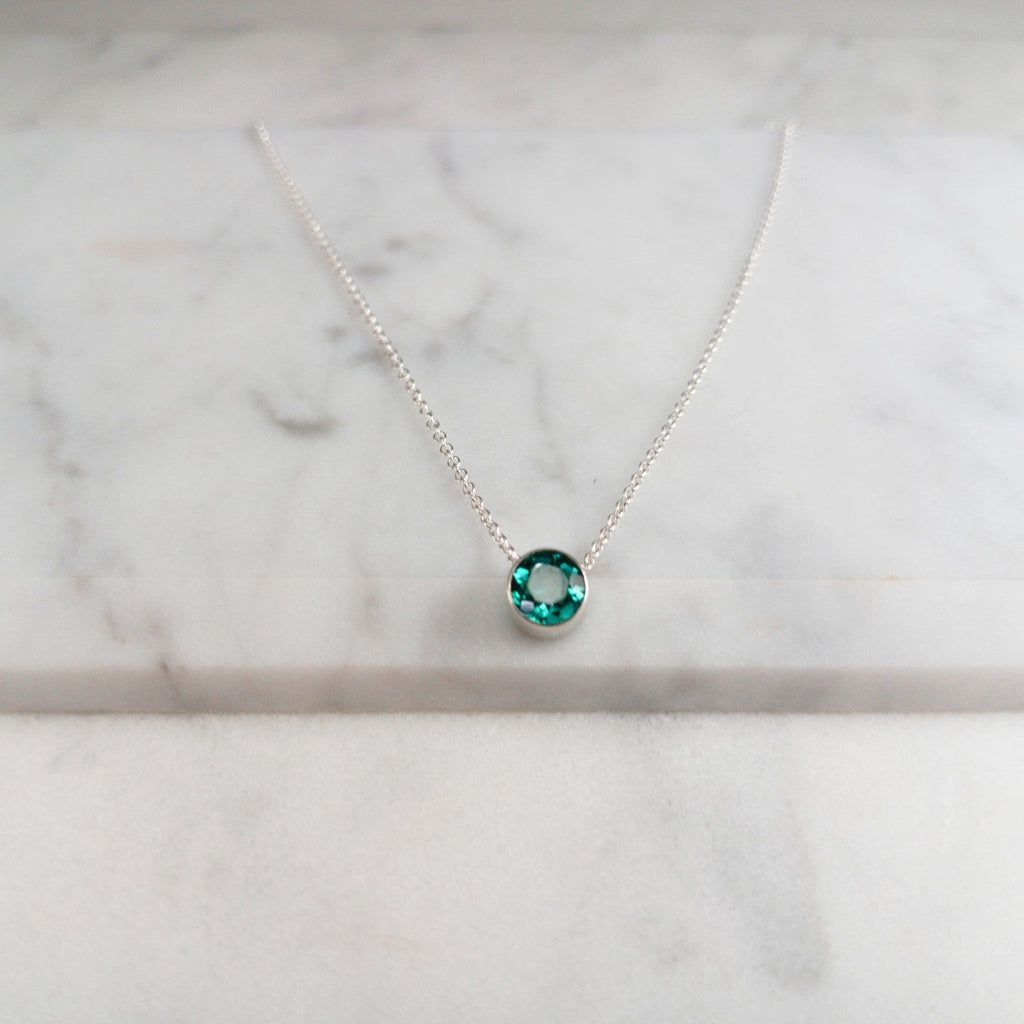 Delicate emerald birthstone pendant on 16-inch silver chain - May's stone of renewal