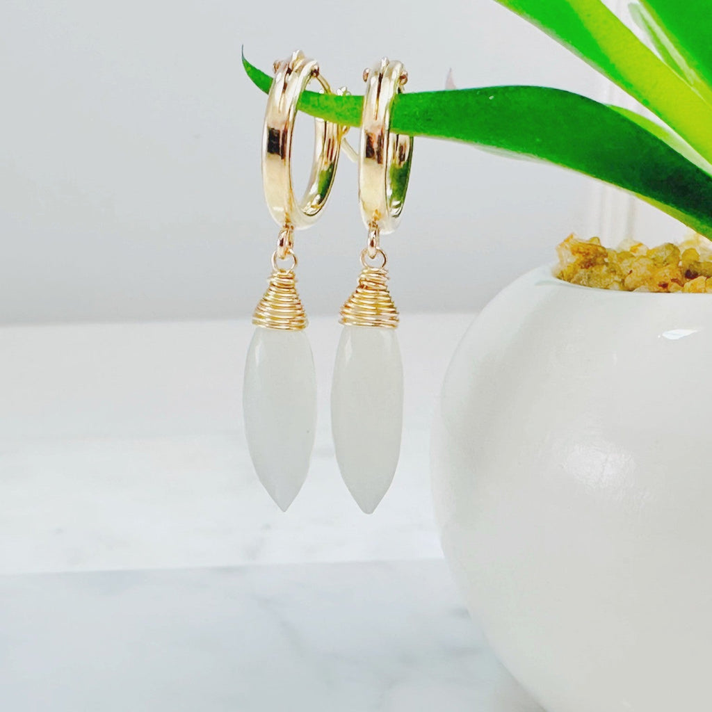 14K gold filled moonstone huggie hoops on marble  – dainty iridescent hoop earrings for women